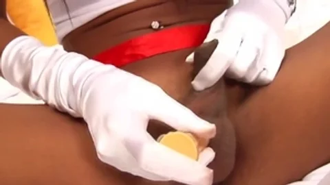 Tanned Ladyboy Nurse Teases With Her Big Tits And Long Dick